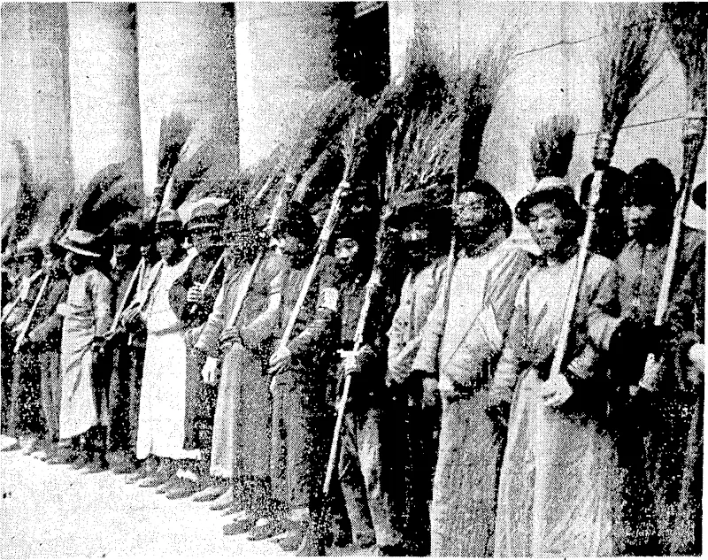 Tivo empty houses in Alpha Place, Kilburn, London, were set on fire recently by order of the Willesden Council. The council decided to burn the houses as an experiment to prevent the spread of vermin in a slum clearance scheme. It was -intended to carry out'the burning in secret, but Press photographers found out and took the picture. "Sport ami General" I'hoto. A "sweep and clean-up" brigade of forced labour al Nanking, where the Japanese invaders have organised 'pivilian refugees into\ bodies to\ carry pn the' worJc of tJie city.. (Evening Post, 28 March 1938)