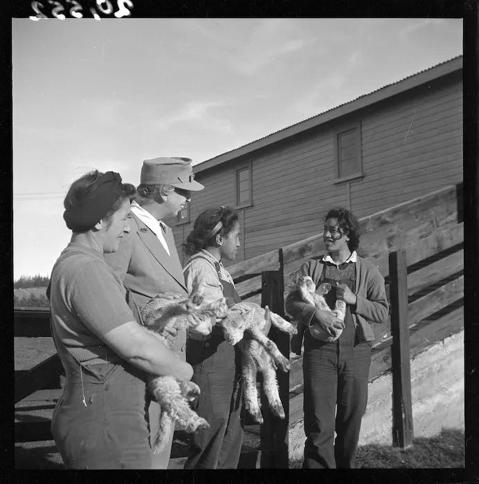 Mrs Eleanor Roosevelt with members of the Women's Land Service and triplet lambs, in Rotorua
