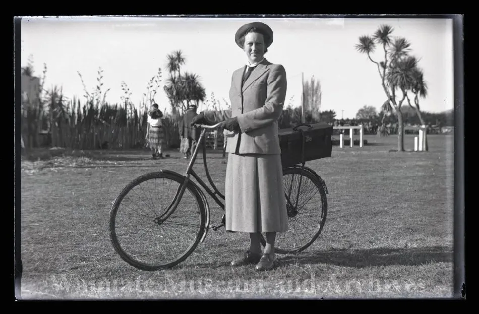 Woman portraying Dr Cruickshank with bike at Waimate Centennial Celebrations