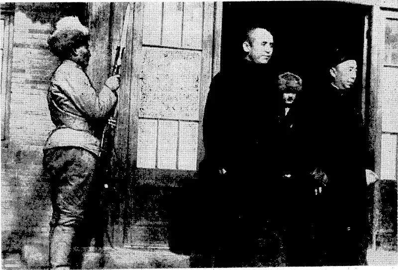Sport (and General"-Photo. A Mongol-military guard presenting arms as the chairman of the Mongolian Autonomous Government, sponsored by the Japanese, left the conference hall on December, 29. Prince Teh Wang (right) is chairman, and General'Li Shou-hsin > Commander-in-Chief of the new Mongolian Army, uniformed and trained by, the Japanese. (Evening Post, 21 January 1939)