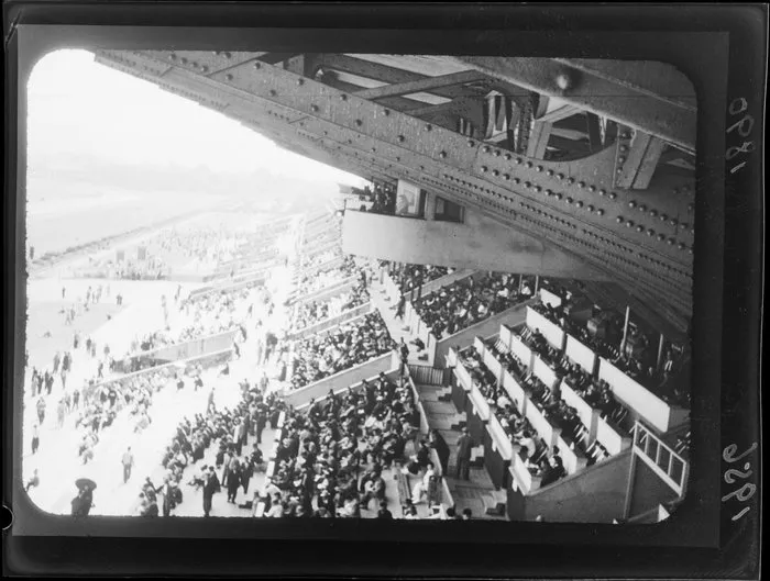 Spectators watching race in a grandstand, Kyoto, Japan, including structural beams