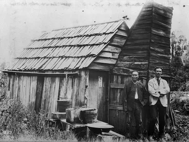 Image: Reverend George Hunter McNeur outside a mining hut with gold miner Chan Kwie Lim