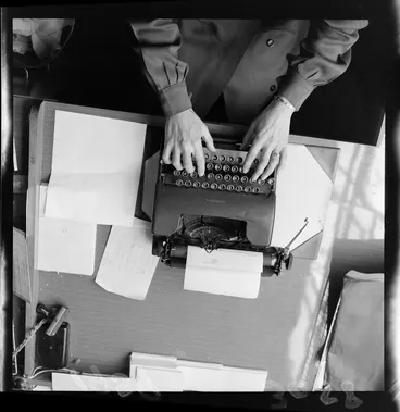 Image: Corona typewriter being used by an unidentified person