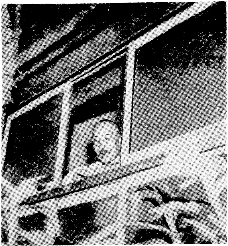 The former Japanese Premier, General lojo, looking out of the window of his bungalow, and inviting officers of the American Intelligence to enter. He then closed the window and shot himself. (Evening Post, 26 September 1945)