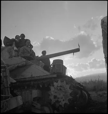 Image: Men of NZ tank formation move towards the bridge across the Sangro in Italy, World War II - Photograph taken by George Kaye