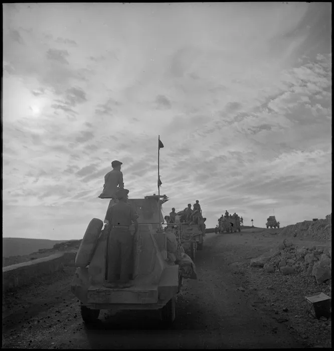Convoy of armoured cars and portees moves up Sollum Hill, Egypt - Photograph taken by M D Elias