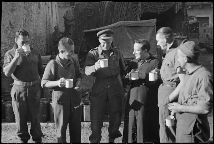 New Zealanders resting behind the Italian Front talk with local priest, World War II - Photograph taken by George Kaye