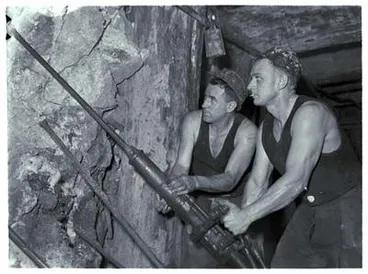 Image: Waihi - Two miners work inside mine.