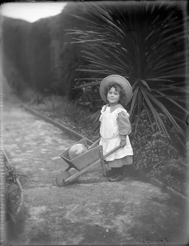 Image: [Owen William Williams?], with a toy wheelbarrow, location unidentified