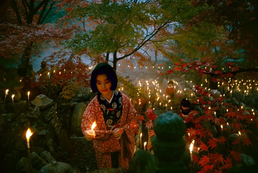 'Offerings to the unknown dead, Kyoto' [Toshi Satow offering a candle]. Taken for a series on Japan for 'Life'