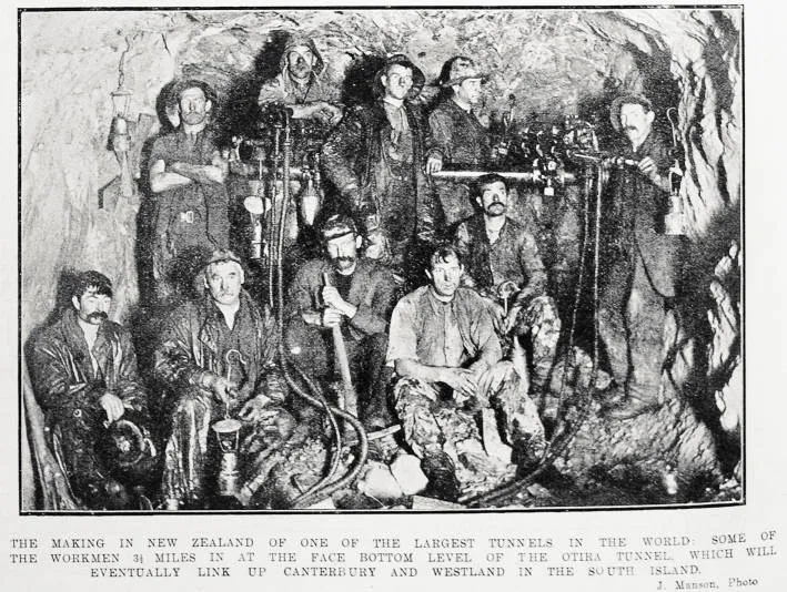 The making in New Zealand of one of the largest tunnels in the world : some of the workmen 3 1/2 miles in at the face bottom level of the Otira Tunnel, which will eventually link up Canterbury and Westland in the South Island