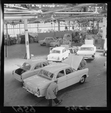 Image: Unidentified mechanics work on automobiles, at a Lower Hutt factory, Wellington