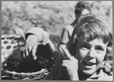 [Belinda Hillary with a young puppy]
