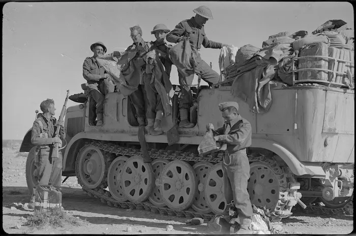 New Zealanders searching an abandoned German troop carrier, World War II