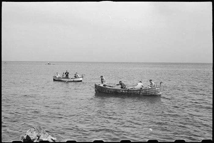New Zealanders from 1 NZ Convalescent Depot fishing from boat off Santo Spirito, Italy, World War II - Photograph taken by George Bull