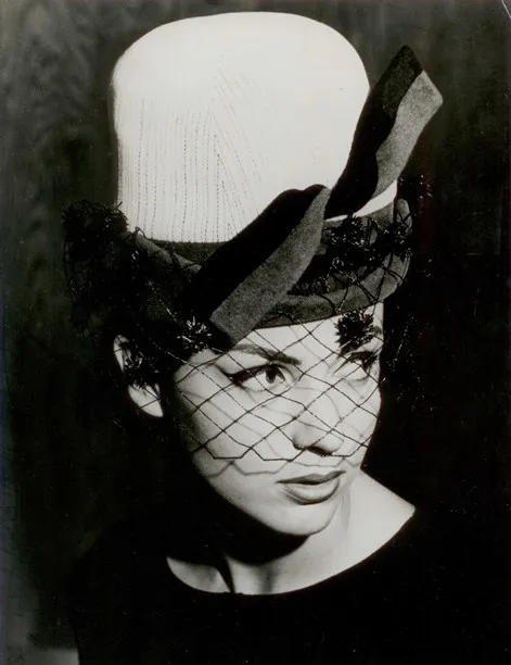 High-domed hat with pompom veiling