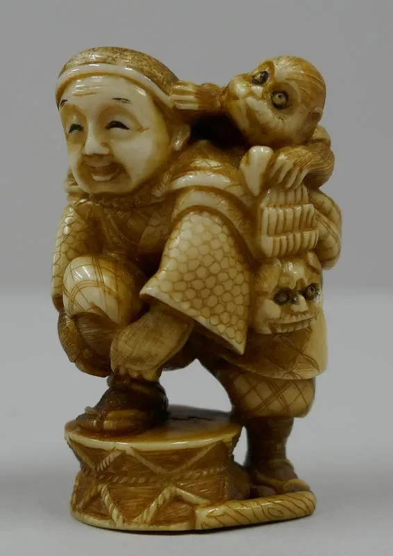 Netsuke: Sarumawashi [A monkey trainer]