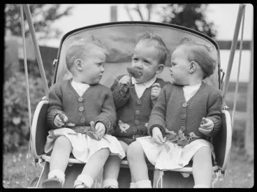 Image: Triplets in a pushchair, 1947