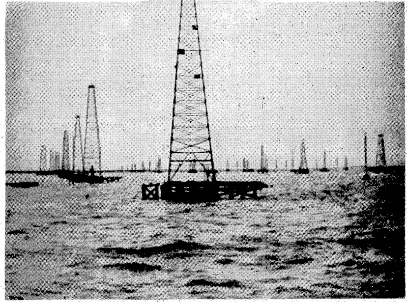 A view >of the; oil \gantries)at Lake Maracaiboy A cablegram 'published ; yesterday reported; a great, fire at -the /oil port,.'.. spreading over- the lake, andrdoing xmuck ; – 'damage. : ;:-/ > j ■. .;... "Evening. Post'1 ~Photo. • 'M. A. Pouquet (centre) for-France, -opened the Hutt Horticultural Society's rose show at Lower Hutt yesterday afternoon. 1 He is seen discussing the blooms with the Hon. 3W. Nash 'v(right),, • ■■-■• – Minister of'Finance. " ■ (Evening Post, 16 November 1939)