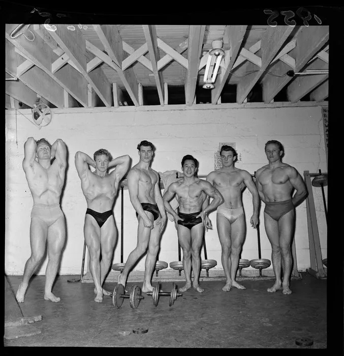 Winner and runners-up in weightlifting competition, posing