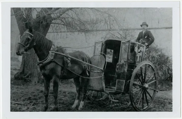 Horse-drawn taxi driver waiting for his next customer, late 1800s