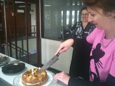 Image: Keiran cuts cake