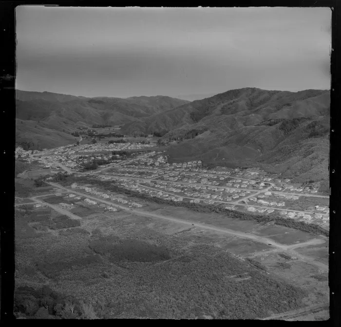 View to the Lower Hutt Valley suburb of Wainuiomata and the Wainuiomata Hill Road with residential housing to the lower valley Coast Road beyond, Wellington City