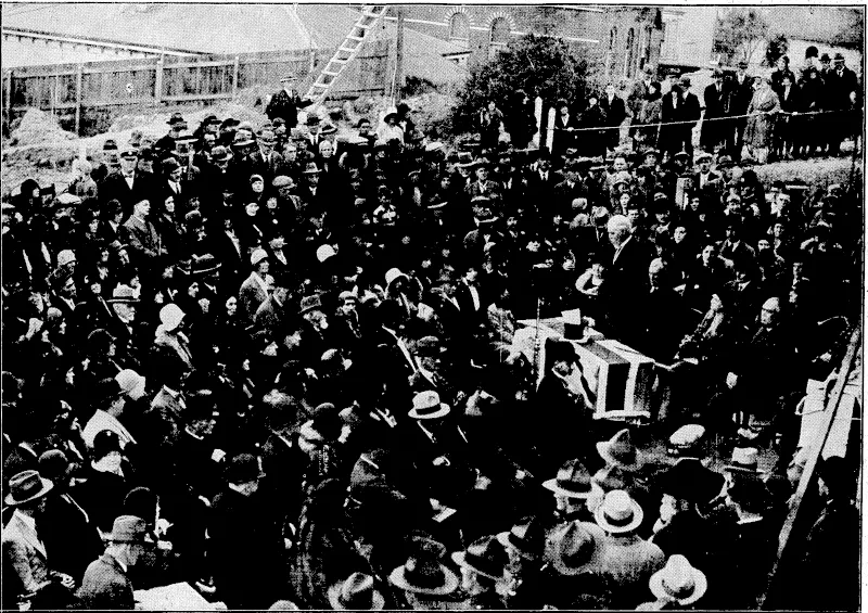 t ' • ' ■ 'Kvehlng rost" Photo,' LAYING THE FOUNDATION-STONE AT THE NATIONAL WAR MEMORIAL CAMPANILE, WHICH WILL HOUSE THE WELLINGTON-WAR MEMORIAL CARILLON.—At the official table, left to right, are the Mayoress (Mrs. Troup), the Prime Minister (the Right Hon. G. W. Forbes), the Mayor (Mr. G. A. Troup. C.M.G.), Mrs. Forbes, and Mr. H. D. Bennett (chairman of the Carillon Society)'. (Evening Post, 16 May 1931)