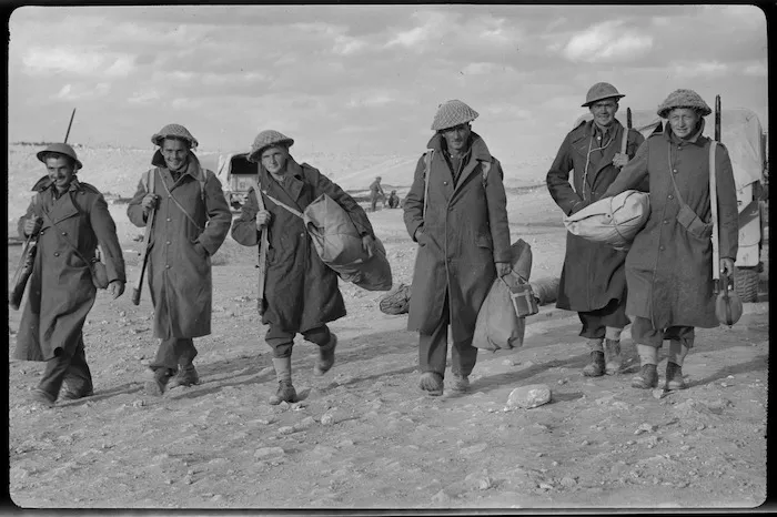 New Zealanders in Tobruk setting out for the line after a rest, World War II