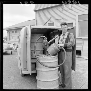 Image: Unidentified man with petrol pump and drum at Rongotai Aero Club, Wellington
