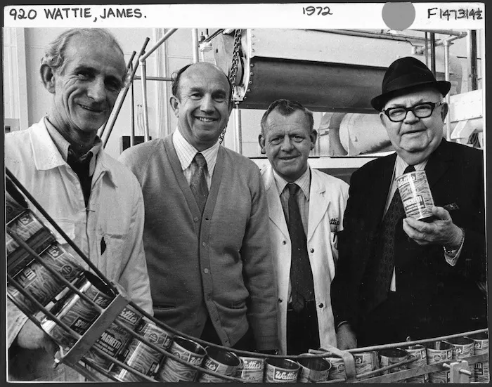 Sir James Wattie with three of his long-serving employees, by the production line for tinned spaghetti at the Wattie's factory in Hastings