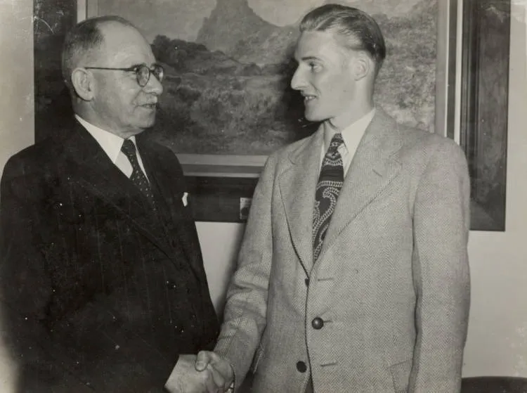 Sir John Allum shakes hands, ca 1945.