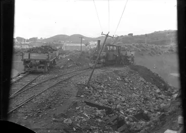 Image: "Reclamation of area between Mikotahi and Paritutu using material carted by train. View from Mikotahi looking East.