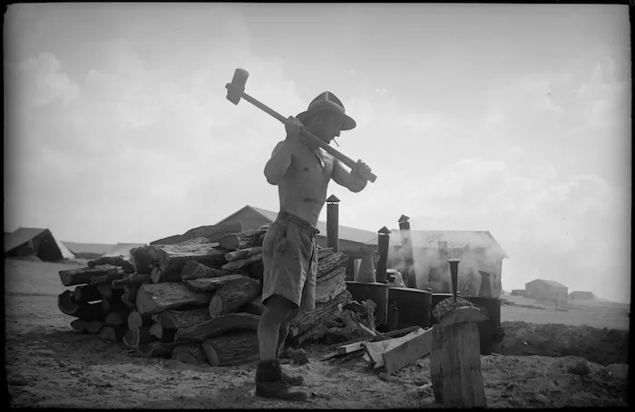Cook chopping firewood, Egypt
