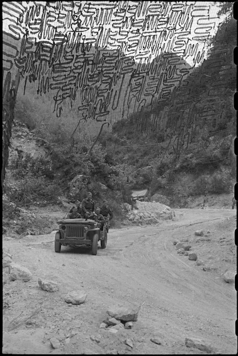 Camouflage nets strung across part of the Inferno Track, Cassino area, Italy, World War II - Photograph taken by George Bull