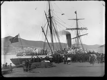 Image: Ship 'Triumph' moored at [Queens?] wharf, Wellington, including crowd on wharf and sheep in pen on deck of ship