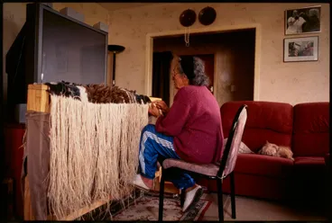 Image: Te Aue Davis weaving a feather cloak, Mangere, Auckland