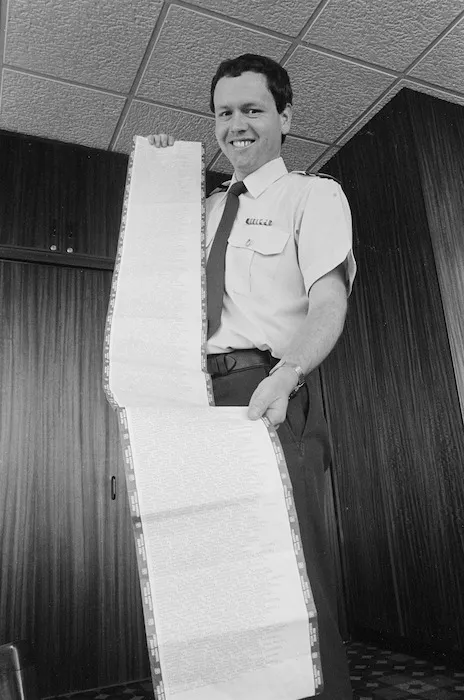 Police Senior Sergeant, Owen Dance, holding a telegram