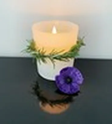 Image: Anzac Day candle with purple poppy