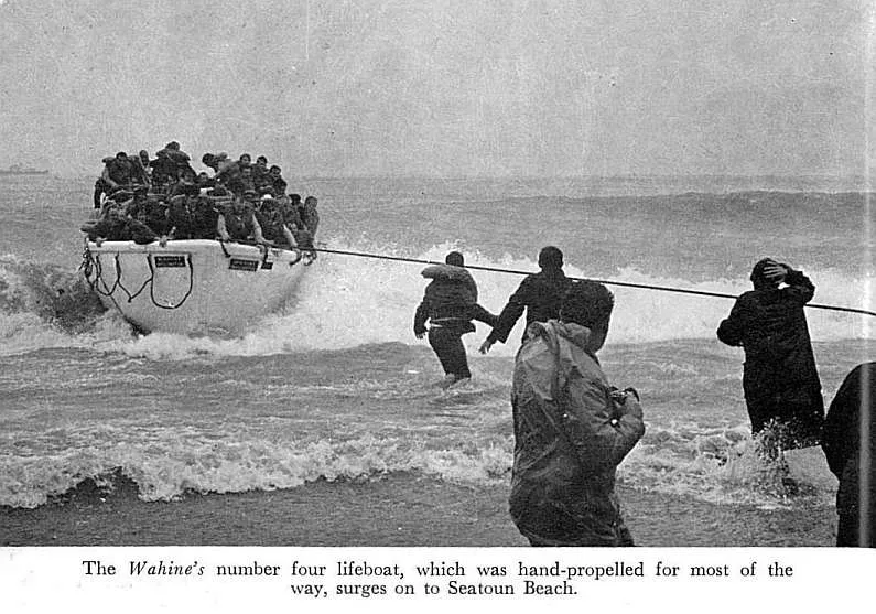 The Wahine's number four lifeboat, which was hand-propelled for most of the way, surges on to Seatoun Beach