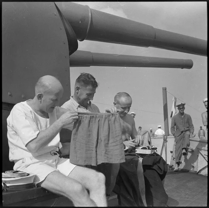 Make and mend on HMS Leander at a Middle Eastern port