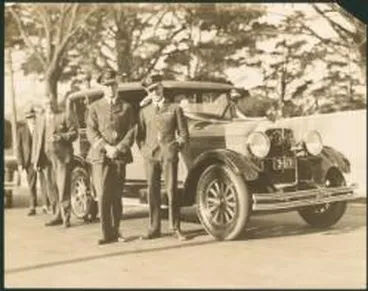 Image: Charles Ulm, front left, and Charles Kingsford-Smith, on right, in front of a Studebaker Commander, Auckland, New Zealand, 1928