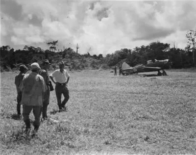 This is the anniversary [?] in which I landed on the KARA airstrip s'Bpile [?]. It was the second aust plane to land, there had been one the previous day, I was the first n-z to see the place from the ground. These are the "reception" party.