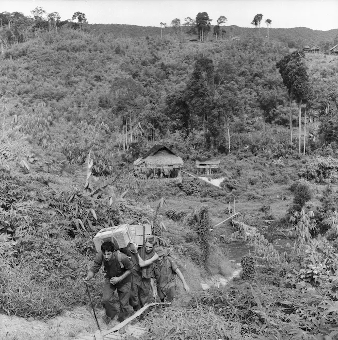 Carrying supplies after an air drop, Malayan jungle