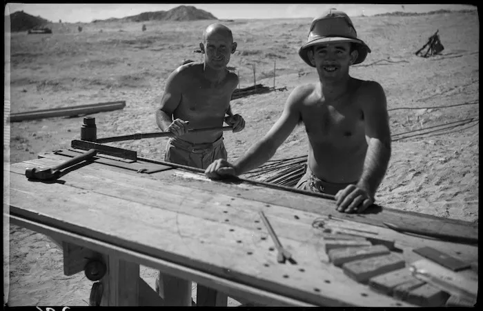 NZ engineers bending iron for reinforcing, Western Desert