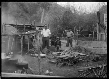 Image: Group of men around a hangi at Te Whaiti, 1930.