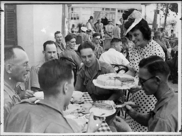 Lady Lampson serving cake at the opening of the Kiwi Club, Helwan