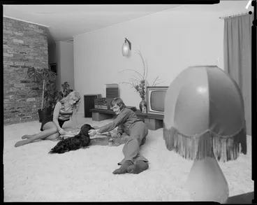 Image: Young people with dog in lounge