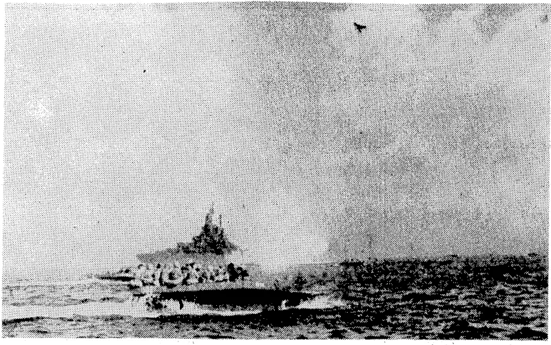 The mighty guns of an American battleship shelling the Japanese on Okinawa. In the foreground amphibious craft loaded with troops are pushing ashore. (Evening Post, 07 May 1945)