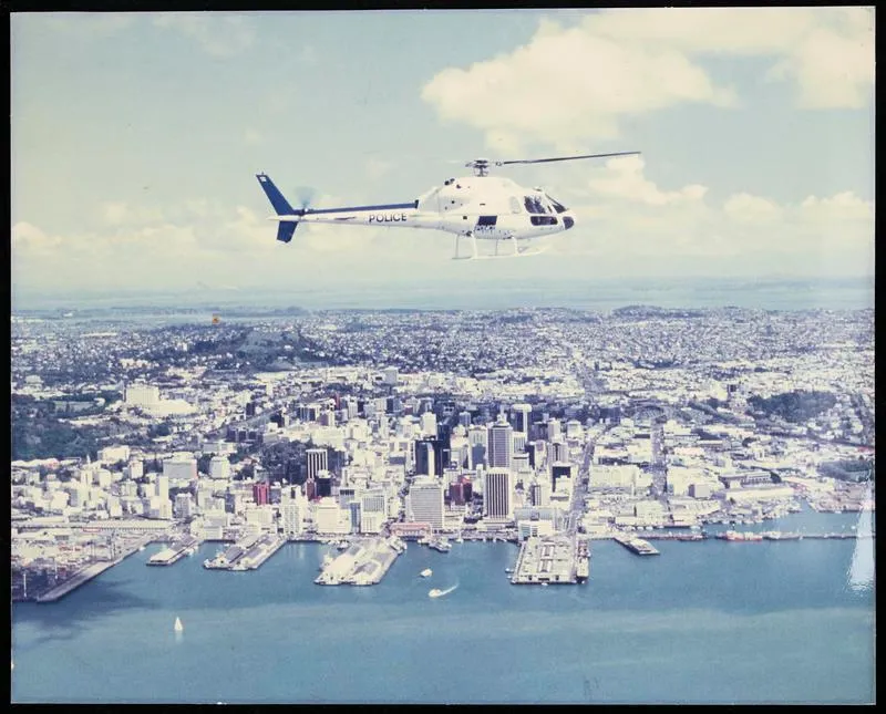 New Zealand Police Helicopter in flight over Auckland CBD and Waitematā Harbour